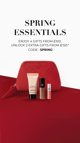 Armani Code Elixir fragrance bottle on a black leather background.