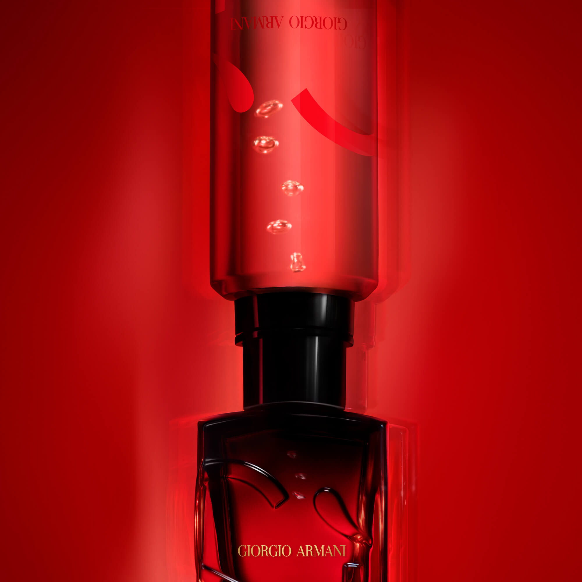 A sleek black and red perfume bottle with droplets of liquid inside, set against a vibrant red background.