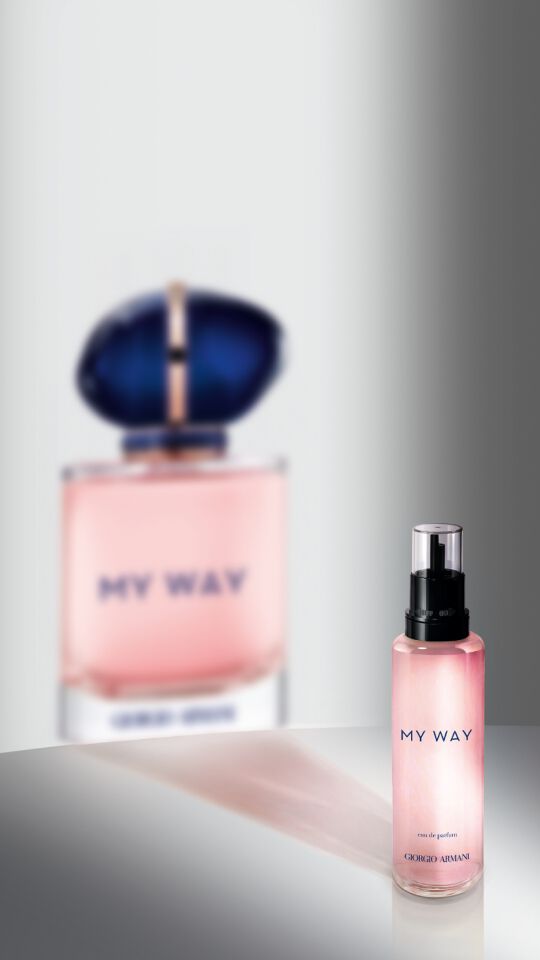 A refill bottle for Giorgio Armani My Way perfume. Its shadow evokes the full-size bottle.