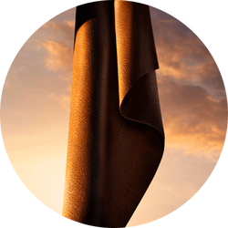 Deep leather drape against a warm amber sky — lavender essence heart note of I Will Eau de Parfum by Giorgio Armani.
