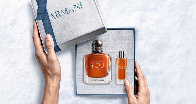 Giorgio Armani "Acqua di Gio" fragrance bottle with a textured blue Armani gift box.