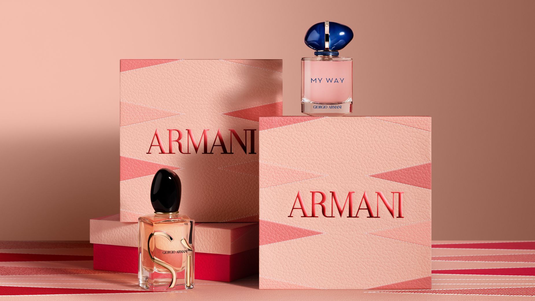 Giorgio Armani "Si" and "My Way" perfume bottles displayed with decorative Armani gift boxes.