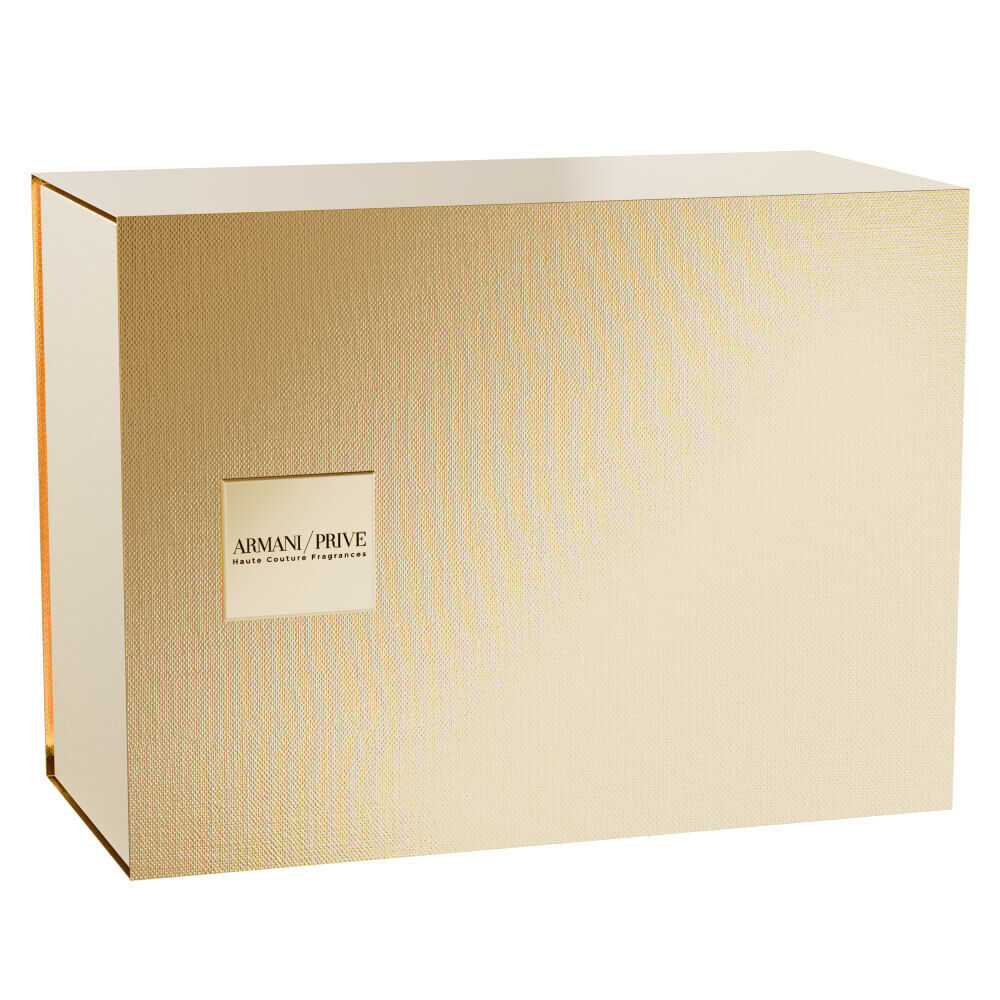Armani Prive Les Eaux The Yulong Holiday gift set closed gold rectangular box with embossed Armani Prive branding, photographed on a white background.
