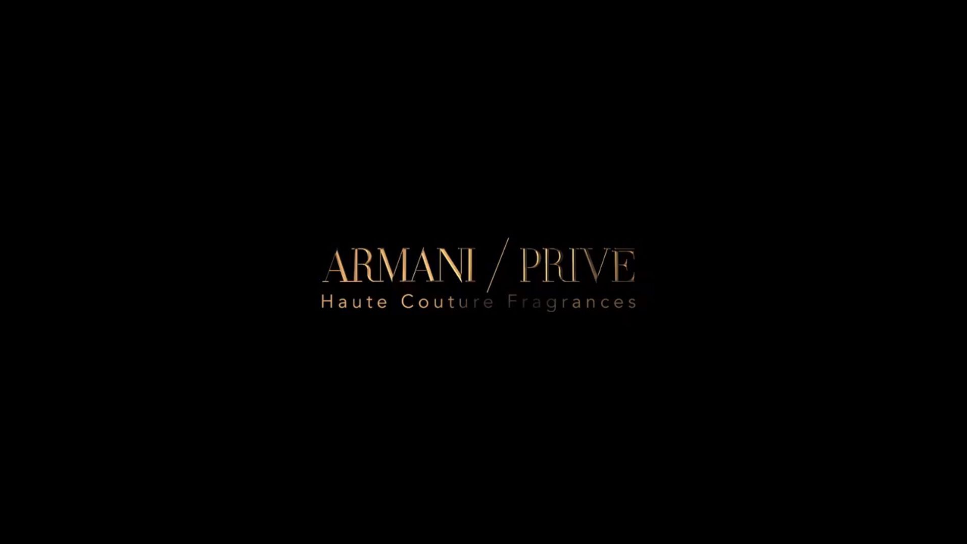Elegant logo of Armani Privé, showcasing haute couture fragrances against a dark background.
