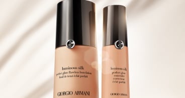 Giorgio Armani Luminous Silk base bottles on a white background with a red design on the bottom.